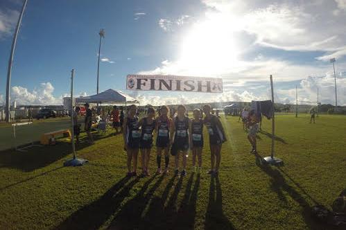 Runners at the finish line of the Far East tournament in Guam 