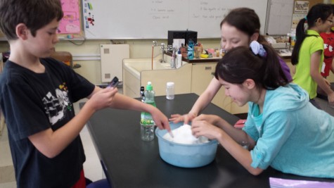 Liam (left) is having some fun with science with Nicole and Emma (both right).