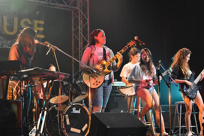 The Loaners performing on stage at ASIJ.
