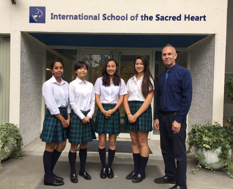 From+the+left%3A+Reshma+%2812%29%2C+Hanako+%2812%29%2C+Mina+%2812%29%2C+Sydney+%2812%29%2C+and+their+teacher+Mr.+Felstehausen%2C+will+be+participating+in+the+MUN+conference+held+in+India.+