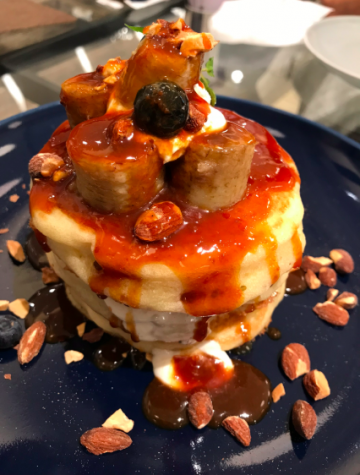 The vegan caramel banana & sake kasu soy milk cream pancake comes topped with a handful of caramelized bananas and with a thick caramel sauce on the side. 