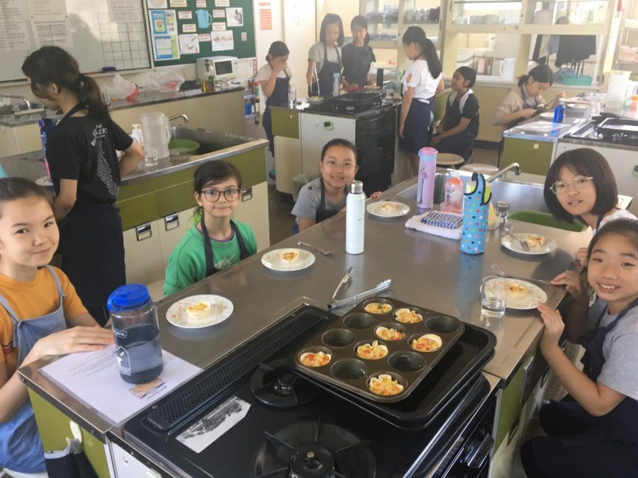 Students from different nations enjoying the food they cooked in Global Kitchen.  