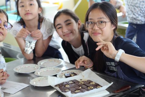 Rafaa shares banana brownies with her cooking group in Just Desserts. 
