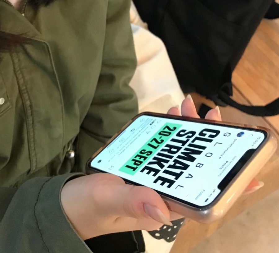A student receives a climate change march notification.