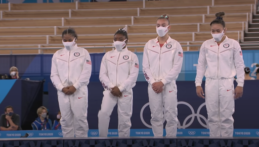 Simone Biles competing in the Women’s Balance Beam in Tokyo 2020 Olympics.