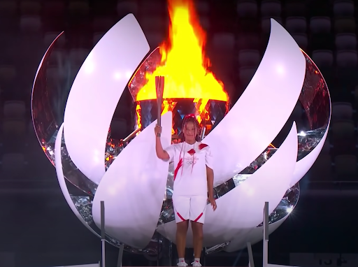Naomi Osaka lighting the Olympic torch at the 2020 Tokyo Olympics opening ceremony in August 2021.