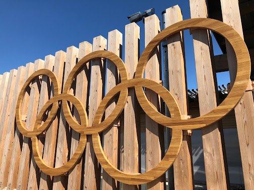 The Olympic rings on the fences at the Olympic village.