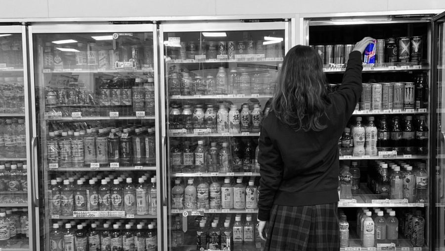 A Sacred Heart student buys a Red Bull from a convenience store. 