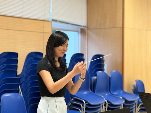 Ms Bae prepares the MS/HS orchestra for the upcoming Christmas Concert. Image credit: Yuki K