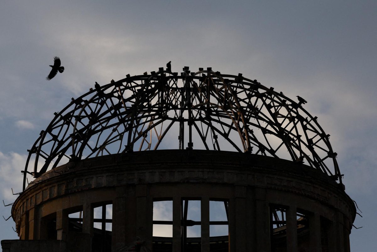 Crows fly over the ruined dome which was abandoned after the World War Two atomic bombing in Hiroshima, western Japan, August 6th, 2025. REUTERS/Kim Kyung-Hoon
