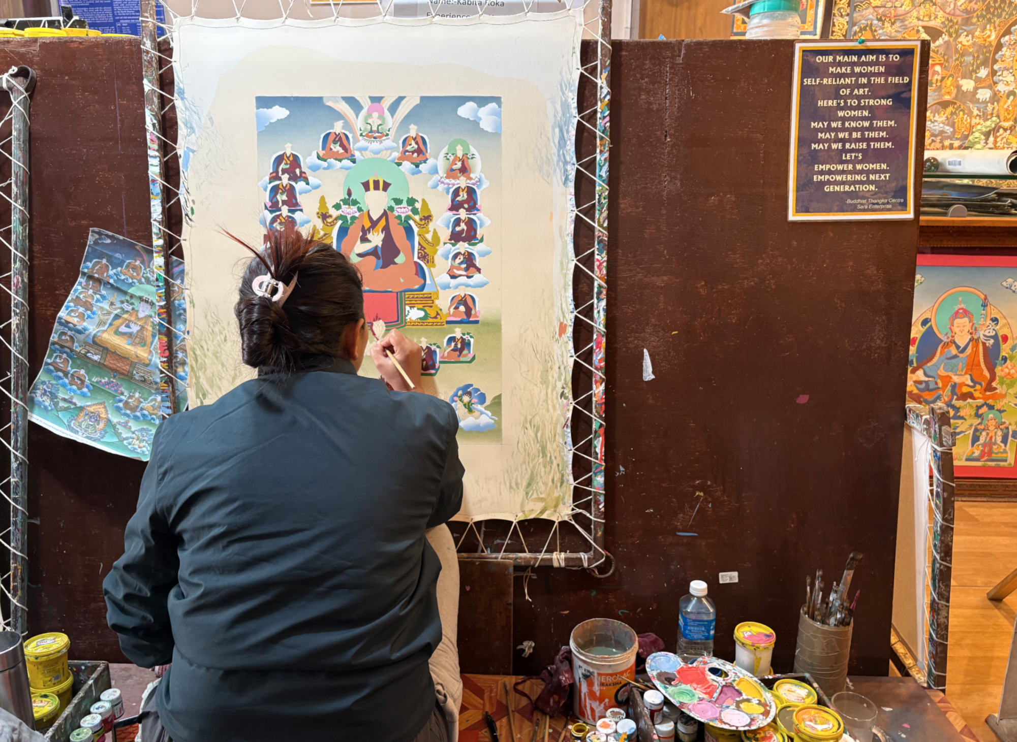 An artist working on a traditional Buddhist mandala at the School of Thangka Art Painting. Credit: Mr. Felstehausen